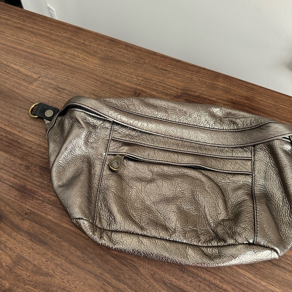 Parker Thatch “cross your heart” leather sling bag.